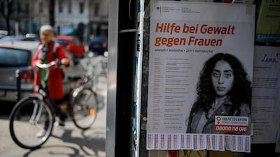A poster at a shop entrance in Berlin on April 7 advertises the phone number of a helpline for violence against women. With families confined to their homes to curb the spread of the novel coronavirus, fears are rising of a surge in cases of domestic violence. AFP