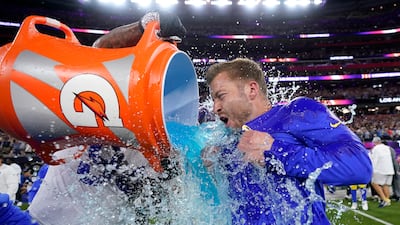 Los Angeles Rams defensive end A'Shawn Robinson, left, pours Gatorade over Los Angeles Rams head coach Sean McVay. Reuters