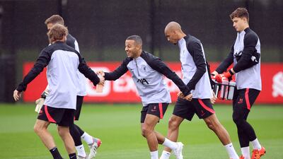 Liverpool's Thiago Alcantara with teammates during training. Reuters