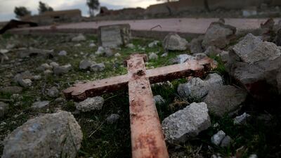 A cross that lies in the rubble of a destroyed church that was blown up by Islamic State militants in the deserted village of Tal Jazeera, northern Syria. The Qatar-based Syrian Network for Human Rights, a Syrian war monitor associated with the opposition said in its report, that over 120 Christian places of worship have been damaged or destroyed by all sides in the country’s eight-year conflict. AP