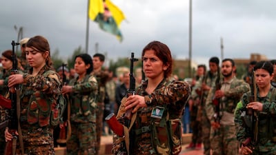 YPJ fighters attend the funeral of a fellow fighter in Qamishli. AFP