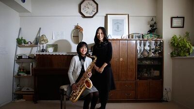 Manami Miyazaki, 39, and her daughter Nanaha, 13, at their home in Tokyo. Manami, who is a housewife, studied until she was 20. Her ambition was to work somewhere where she could meet lots of people. She hopes that her daughter will build a loving home with a happy marriage. She says it would be great if her daughter could find work that makes use of her abilities and interests. Nanaha wants to be either a designer, musician or a nurse. Toru Hanai / Reuters