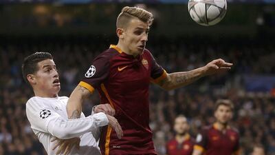 Real Madrid midfielder James Rodriguez and Roma fullback Lucas Digne in action. Susana Vera / Reuters