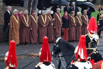 A delegation of Omani representatives await the arrival of Oman's Sultan Haitham in Windsor. AFP