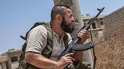 A Syrian rebel fighter belonging to the Martyrs of Maaret Al Numan battalion holds position in a southern-Syrian town. The Obama administration could give the rebels a range of weapons, including small arms, assault rifles, shoulder-fired remote-propelled grenades and other anti-tank missiles.