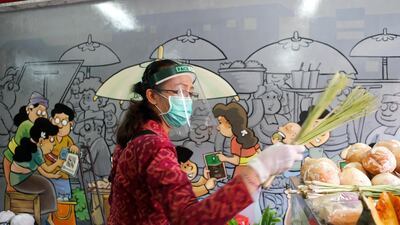 A woman shops in a market in Bali, Indonesia. AP Photo