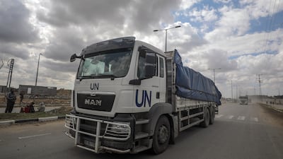 Trucks carrying aid to Gaza cross from the border with Egypt on March 8. The limited amounts of supplies delivered so far are not enough to meet people's needs and NGOs have called for full road access to the enclave. EPA