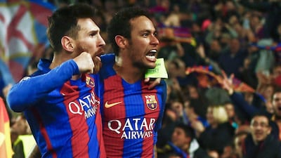 Lionel Messi, left, and Neymar celebrate after Barcelona defeated Paris Saint-Germain 6-1 at the Camp Nou to advance to the Uefa Champions League quarter-finals. Quique Garcia / EPA