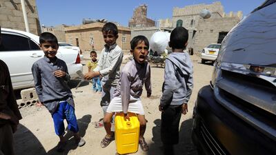 Yemeni children collect drinking water from a donated water tank amid a cholera outbreak in Sanaa, Yemen, 12 October 2018. EPA