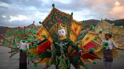 Shan ethnic artists performing a traditional dance on the opening day of the week-long Tazaungdaing Lighting Festival in Taunggyi, Myanmar's northeastern Shan State. AFP