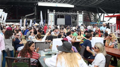 Visitors to last year’s inaugural Taste of Abu Dhabi food festival at du Arena on Yas Island. Pawan Singh / The National