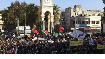 Demonstrators protest against Syria's President Bashar Al Assad after Friday prayers in Idlib.