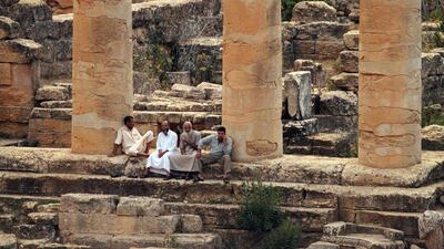A general view shows people visiting ruins at the archaeological site of the ancient Greek city of Cyrene, a colony of the Greeks of Thera (Santorini) and a principal city in the Hellenic world founded in 630 BC, located in the suburbs of the Libyan eastern town of Shahat. AFP