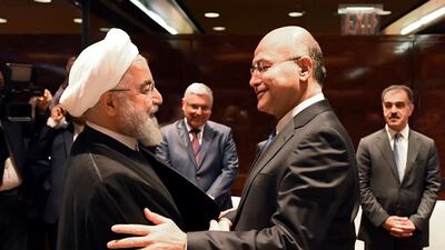 Iraq's President Barham Salih shakes hands with Iran's President Hassan Rouhani in New York on September 25, 2019. Reuters