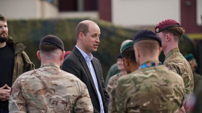 Prince William meets members of the British military during his visit to the 3rd Brigade Territorial Defence Force base. Getty