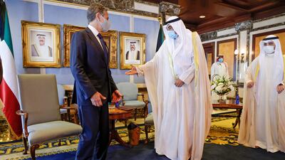 Kuwait's Prime Minister Sabah Al Sabah welcomes US Secretary of State Antony Blinken at Al Seif palace in Kuwait City.
