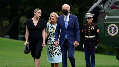 Joe, Jill and Naomi Biden walk across the South Lawn of the White House after returning on Marine One from a weekend in Wilmington, Delaware. AP