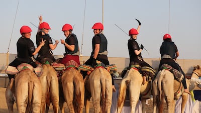 Female participants prepare to compete during the first Female Camel Racing Series C1 Championship at Al Marmoom Camel Racing Track in Gulf emirate of Dubai, United Arab Emirate, 22 October 2021. Eight female participants took part in the race, seven of them got a training riding course at the school of Arabian Desert Camel Riding Centre (ADCRC) which is the first of its kind in the region, the first center dedicated to teaching camel riding and especially for women. EPA / ALI HAIDER