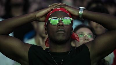 A French supporter watches the World Cup semi-final match between France and Spain on a giant screen at Toulouse Stadium. AFP