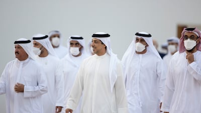 Sheikh Mansour bin Zayed, Deputy Prime Minister and Minister of Presidential Affairs; Sheikh Tahnoun bin Zayed, National Security Adviser (R); and Sheikh Sultan bin Hamdan bin Mohamed, Adviser to the President and chairman of the Camel Racing Federation (L), arrive for the group wedding.