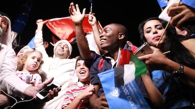 UAE residents celebrate Dubai’s success in winning the right to host what will be the first world fair in the Middle East. Ali Haider / EPA