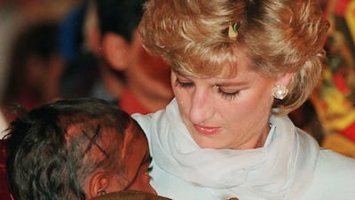 Diana, Princess of Wales, cradles a young cancer patient in her arms during a visit to Shaukat Khanum Hospital on February 22, 1996 in Lahore, Pakistan. Getty Images