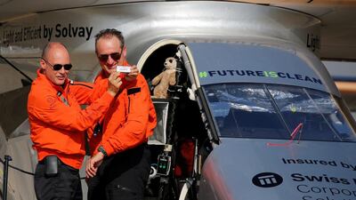 Andre Borschberg, right, the Swiss pilot of Solar Impulse 2, is greeted by fellow pilot and countryman Bertrand Piccard after landing at Cairo Airport. Amr Abdallah Dalsh / Reuters