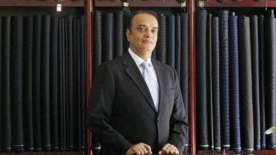 Ashok Sawlani, a partner in his family's bespoke tailoring business, has had his share of financial ups and downs. Jeff Topping / The National