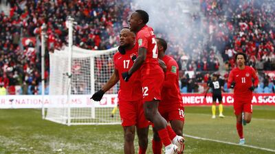 Cyle Larin celebrates with Richie Laryea and Junior Hoilett after scoring Canada's opening goal against Jamiaca in the 2022 World Cup Qualifying match at BMO Field on March 27, 2022 in Toronto, Ontario, Canada. Getty
