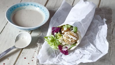 Tahini, a sauce made from sesame seeds, is used as a condiment as well as in dishes such as hummus. Getty Images