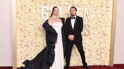 Lily Gladstone and Leonardo DiCaprio, in Giorgio Armani. Getty Images via AFP