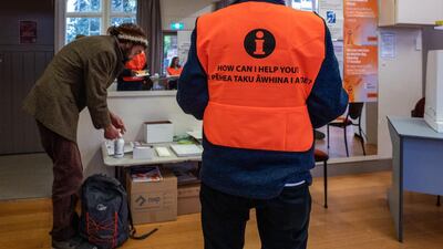 A voter applies hand sanitizer before casting his vote at the Aro Valley Community Centre polling station during the New Zealand General Election in Wellington, New Zealand. Bloomberg