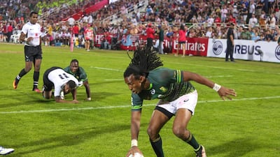 South Africa, in green, will be back in Dubai to defend their Dubai Sevens Series title. The National