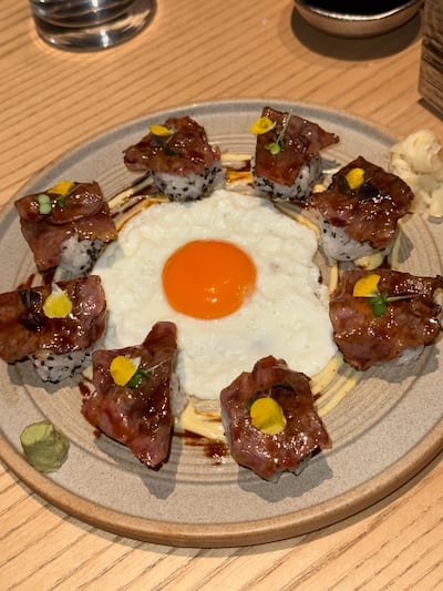 The sunny side egg was broken, so every roll can be coated in the soft yolk. Hala Nasar / The National