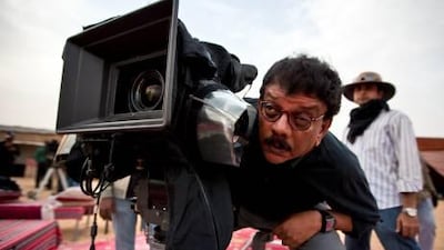 Indian movie director Priyadarshan checks the camera framing on the set of his latest film, Attaram Madhavan Nair (Perfume and Madhavan Nair), in the desert outside of Abu Dhabi. It is the first Malaylam film to be shot entirely in the emirate of Abu Dhabi as the story of the film revolves around the lives of two men who work in Abu Dhabi.