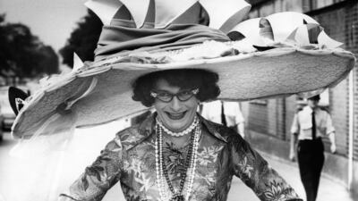 Australian comedian Barry Humphries, dressed as his most famous character Dame Edna Everage, in a hat based on the Sydney Opera House. Getty Images