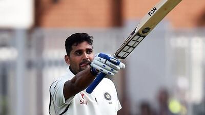India's Murali Vijay celebrates after reaching his century in Nottingham,. Paul Ellis / AFP