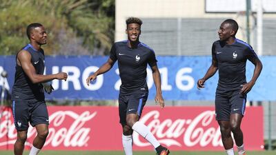 From left, France’s Patrice Evra, Kingsley Coman and Blaise Matuidi attend a training session at the Centre Robert Louis Dreyfus, in Marseille, southern France, Wednesday, July 6, 2016. France will face Germany in a Euro 2016 semi-final match in Marseille on Thursday, July 7, 2016. Claude Paris / AP Photo