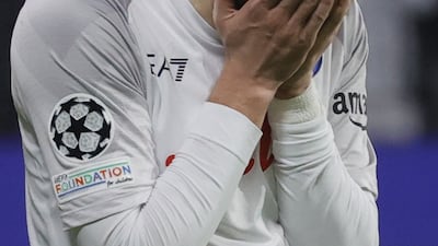 Napoli's Khvicha Kvaratskhelia reacts after missing a penalty. EPA