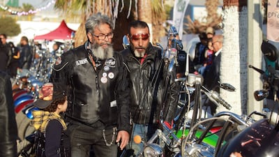 Libyan bikers admire motorcycles in Benghazi.