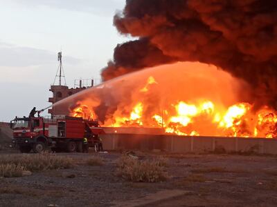 Firefighters attempt to extinguish a fire at a power plant following Israeli air strikes on Hodeidah city, Yemen, 29 September 2024. EPA
