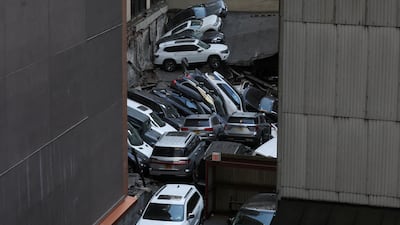 Piles of cars and debris. Reuters