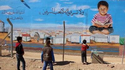 Children play inside Zaatari, the largest camp for Syrian refugees in Mafraq, Jordan. AP