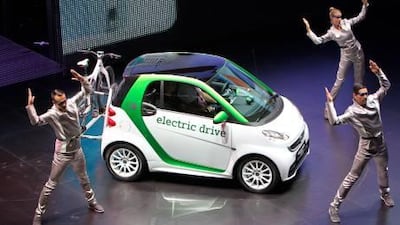 There are many highs, and a few lows, at this year's German car-fest, but the interesting aspect is the marked rise in manufacturers showcasing their electric power credentials. Above, dancers perform during the presentation of the new e-smart by German car maker Daimler AG.
