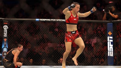 Weili Zhang celebrates after defeating Carla Esparza to win their Women Strawweight fight at UFC 281. Getty