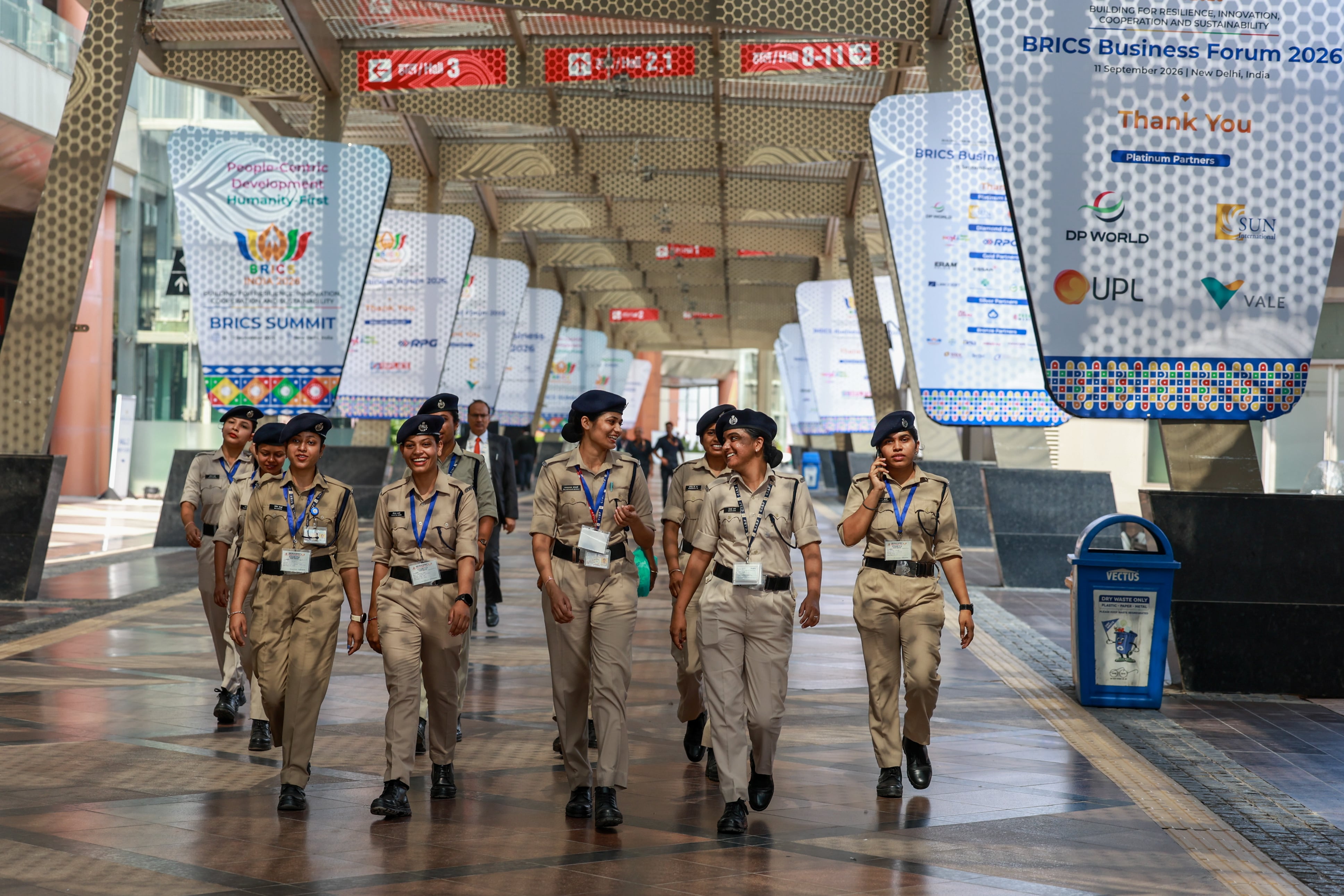 Indian women security personnel walk through the venue for the summit. EPA