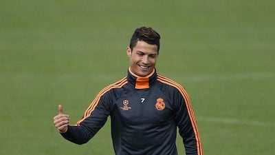 Cristiano Ronaldo flashes a thumbs-up during Real Madrid's training session on Tuesday. Pierre-Philippe Marcou / AFP / April 1, 2014