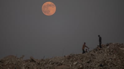 A full moon rises over Khan Younis in the southern Gaza Strip. EPA