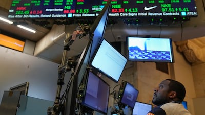 Traders work on the floor at the New York Stock Exchange. The current economic environment remains challenging for equity markets. AP