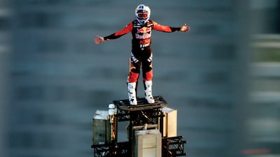 Dakar Rally rider Sam Sunderland stands on top of Burj Khalifa in new tourism video. Photo: Dubai Tourism